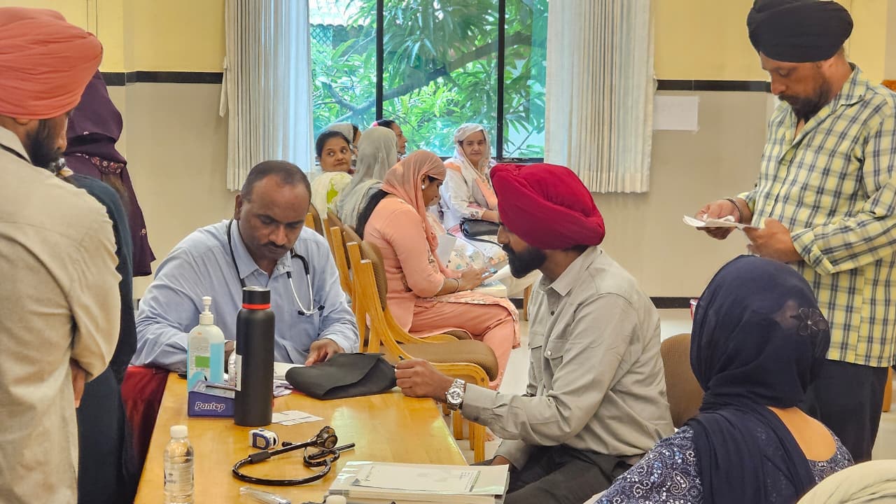 Doctor conducting a medical consultation at the Health Checkup Camp in Vapi